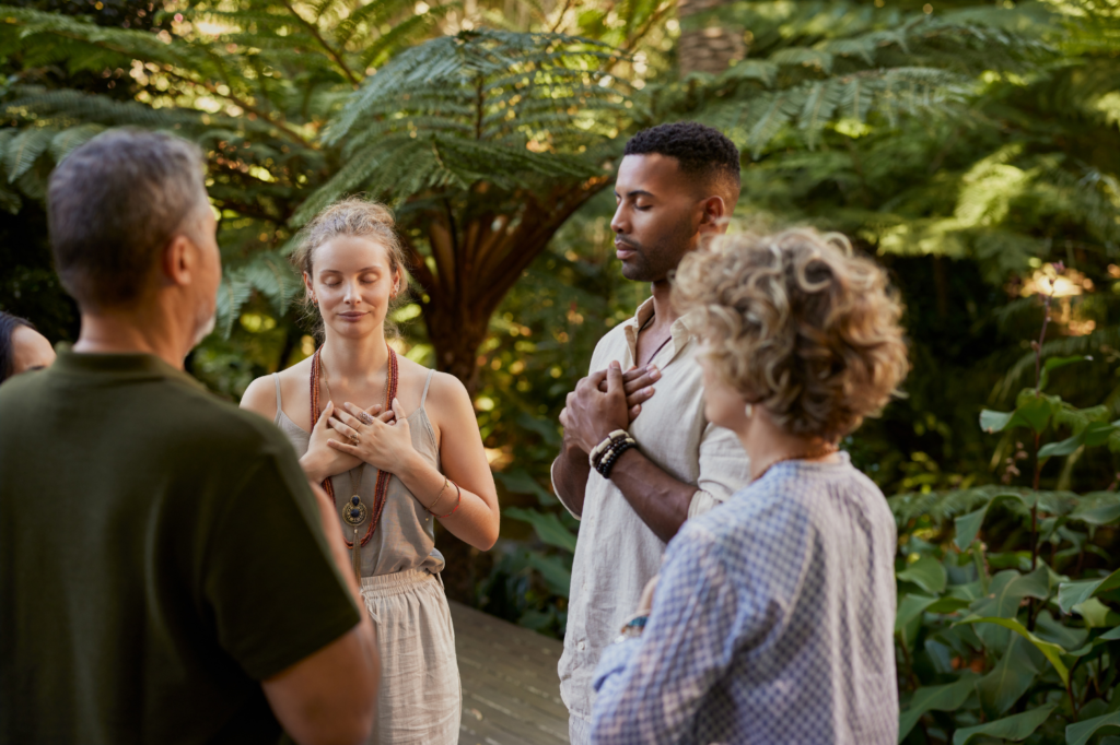 People practicing group healing together in a peaceful wellness setting