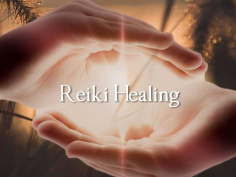 "Gentle hands channeling healing energy in a Reiki session, surrounded by a peaceful nature backdrop with soft light, featuring the bold 'Reiki Healing' title for spiritual wellness."